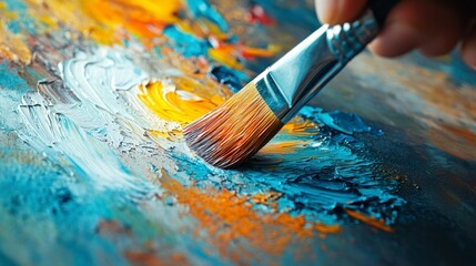 Obraz premium Hand Holding Brush While Painting Colorful Abstract Artwork