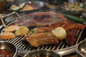 Grilled food with meat and vegetables in Korean style.