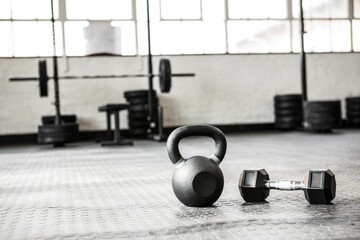 Close up of dumbbell and kettlebell