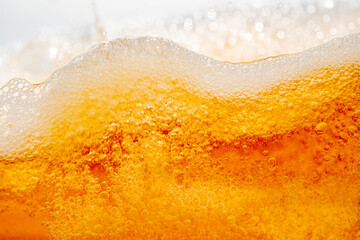 Close up bright orange Oil or beer splash texture and nature waves, Beautiful waves curve and...