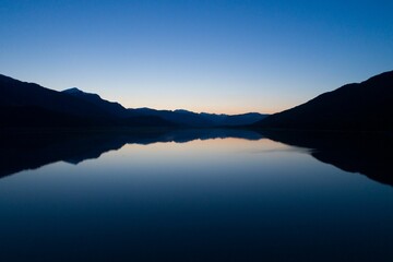 Scenic view of lake against clear blue sky