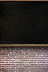 Flat design is showing blank blackboard being mounted on wooden frame above exposed brick wall