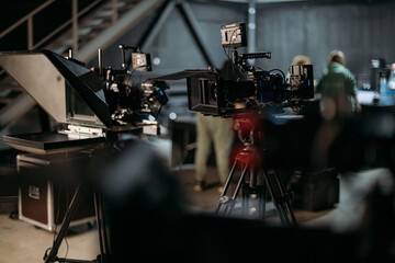 Professional film and video cameras on the set. Filming crew, lighting equipment, professional...