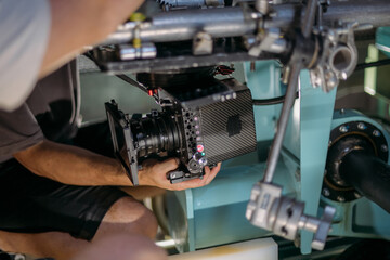 Professional film and video cameras on the set. Filming crew, lighting equipment, professional filming equipment and crew. Methods of modern film production and advertising.