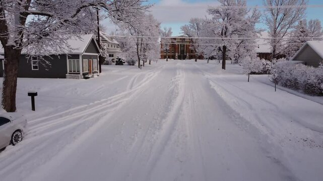 Fly to courthouse in small town in winter snow 