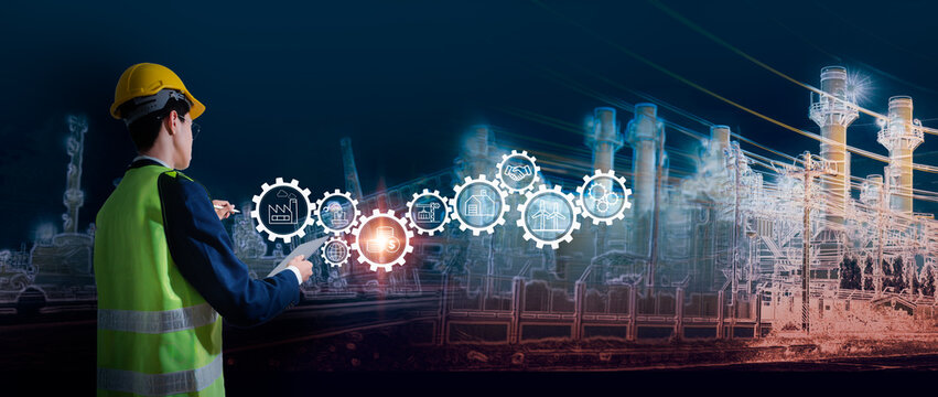 Smart industrial engineer working with futuristic technology interface, industry 4.0 concept with automation, digital transformation, supply chain, production and energy icons in factory background - Powered by Adobe