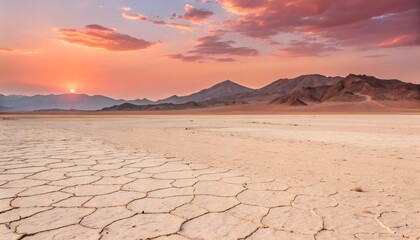 A vast, flat desert landscape stretches across the image, extending towards a horizon line with distant mountains