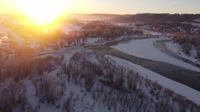 Bright sunrise over winter river 