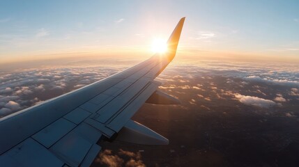 A breathtaking sunset seen from an airplane window, offering a peaceful and inspiring view of the horizon above fluffy clouds, symbolizing travel and exploration.