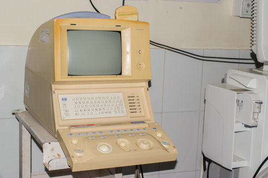 Old vintage ultrasound machine placed in a hospital diagnostic room. legacy medical equipment used for sonography and imaging in clinical healthcare settings