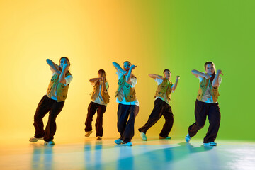 A group of diverse dancers showcases urban moves in a vibrant studio setting. Concept of multicultural expression and energetic choreography.