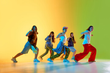 Youthful dancers showcase vibrant moves in a colorful urban setting, expressing creativity and energy. Concept of modern dance culture in city environments.