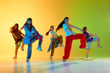 Youthful dancers express urban culture in a vibrant performance setting. Concept of modern artistry celebrating diversity and dynamic movement.