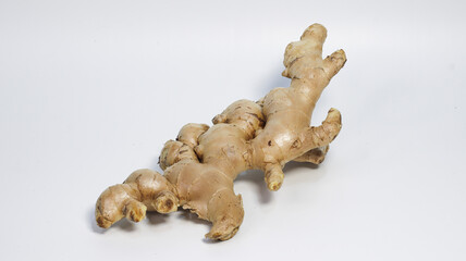 Ginger: A close-up of a raw ginger root, exhibiting its textured skin and distinctive shape