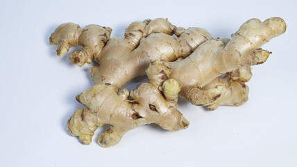 Ginger Root Close-up: The image showcases a detailed view of a fresh, raw ginger root, highlighting its unique texture and form. A natural health ingredient.