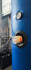 Thermostat control knob on a boiler, gas or hot water boiler. Eco mode concept on a heating system...