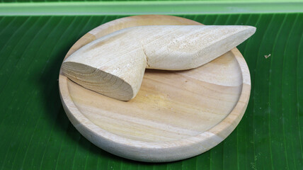 Wooden Utensils: An intimate top-down shot showcases a traditional wooden mortar and pestle.