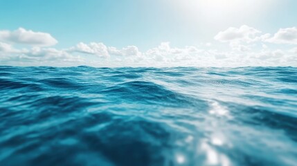Fototapeta premium A serene landscape of the vast ocean, showcasing gentle waves under a bright blue sky, evokes a sense of calmness, freedom, and connection with nature.