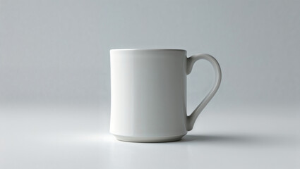 Obraz premium A minimalist image showcasing a single white ceramic mug against a plain light gray background space