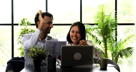 Indian business people celebrating success, Asian corporate man, woman in professional formal attire working on project using laptop, reports at modern office, celebrating result with fist, high five - Powered by Adobe