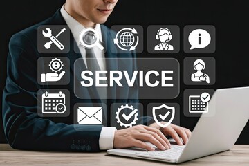 Businessman using laptop with service icons on screen showing customer support and technical assistance