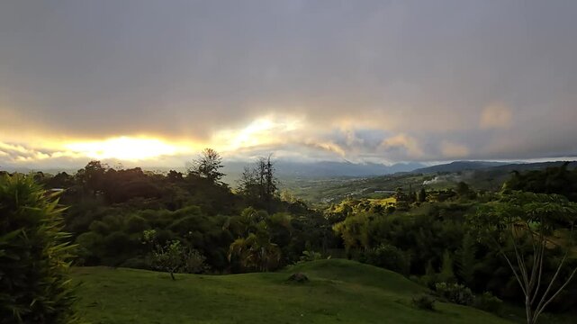 Time lapse of scenic landscape in El Carmen, Valle del Cauca, Colombia with dramatic moving clouds, changing natural light, rural mountains, lush greenery and serene Andean countryside views