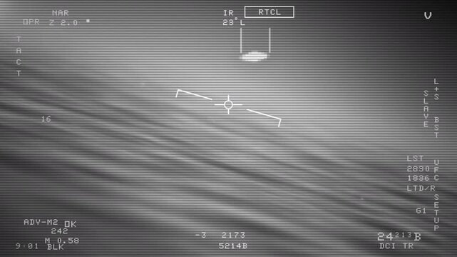 POV of Navy jet following a UFO flying saucer in the sky over ocean waters. Point of view found footage from military aircraft tracking an unidentified flying object or spaceship cruising the sky