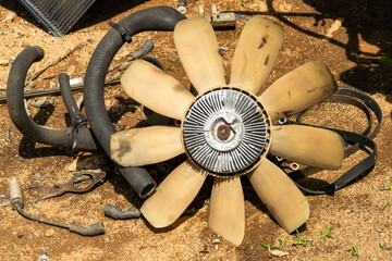 A radiator fan from a truck wreck