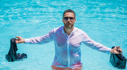 Business failure. Angry businessman on summer vacation. Wet freelancer has remote work crisis. Businessman with briefcase at swimming pool. Angry freelancer. Business trip
