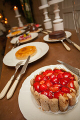 A delightful assortment of beautifully crafted cakes and tarts, artistically arranged for a festive and joyous table