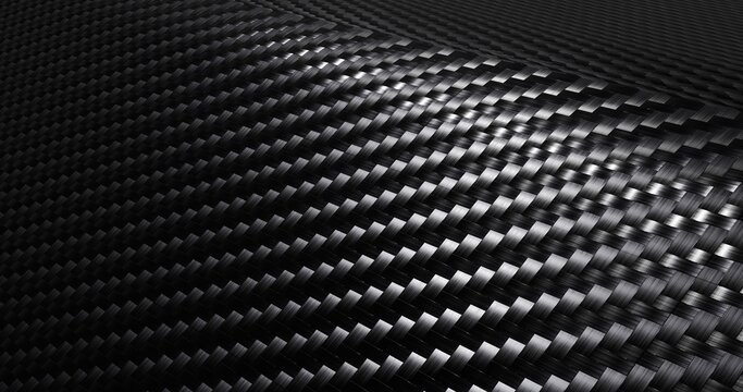 Carbon fiber textured material placed on a curved path with light shining from one side 