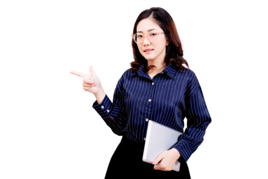 Asian young beautiful woman with glasses, wearing a blue striped shirt, holding a tablet and pointing with her right hand.