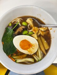 chicken soup with vegetables and egg