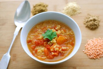 Deliciously hot lentil vegetable soup in a bowl, a healthy and traditional meal perfect for lunch or dinner