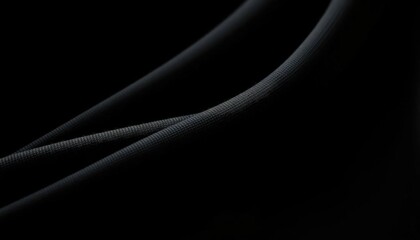 Close-up studio shot of draped black athletic knit fabric