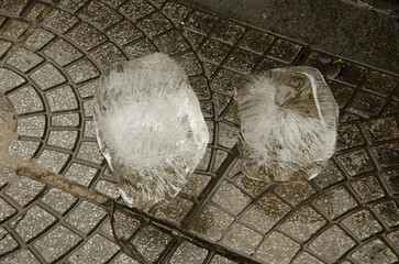 Two blocks of ice abandoned in the street. Hanoi. Vietnam.