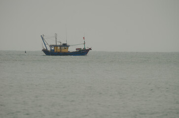 February 26, 2024, Lan Ha Bay: Fishing boat sailing. Cat Ba Archipelago. Vietnam.