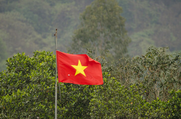Flag of Vietnam. Van Long Wetland Nature Reserve. Gia Vien District. Ninh Binh Province. Vietnam.