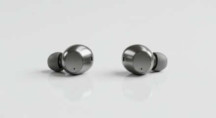 A pair of sleek wireless earbuds placed symmetrically on a glossy white background