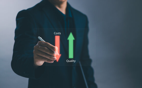 Quality increase and reducing cost Business strategy concept ,Businessman holding pen showing business project management with virtual graph for cost control and maintain product and service quality