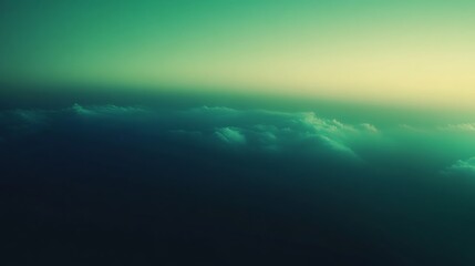 Dreamy green landscape with soft clouds and gradient sky for wallpaper or background use