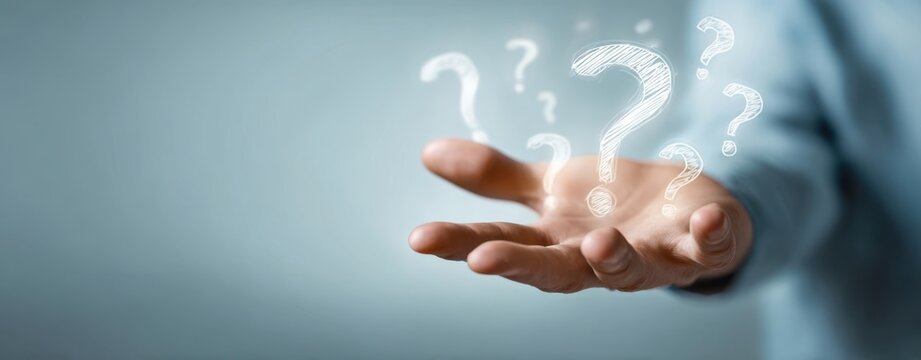 The hand reaching out with floating question marks representing curiosity and inquiry. - Powered by Adobe