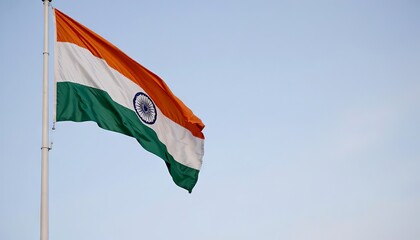 Indian national flag waving against clear blue sky  