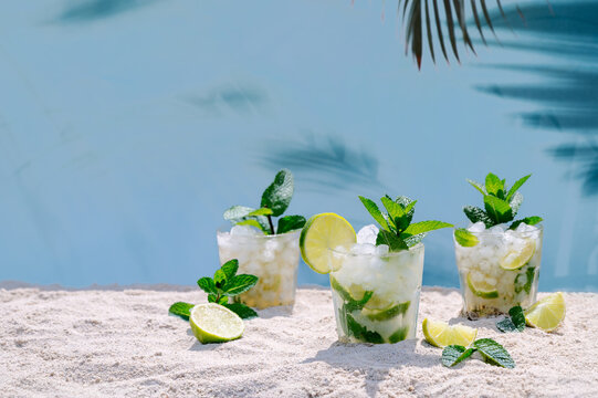 Refreshing mojito cocktails on a sandy beach