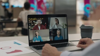 Woman engages in video conference with colleagues via laptop sitting in cafe. Office worker discusses ideas collaborating with team remotely during online meeting. Team videochat - Powered by Adobe