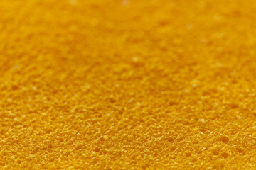 Frozen orange mousse background texture. Selective focus.