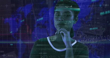 IT specialist standing in data center, resting hand under chin, viewing world map projection