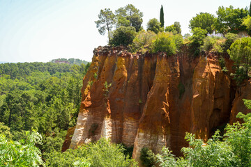 Panorama of the ochre cliffs near the village of Roussillon in the heart of the Luberon National...