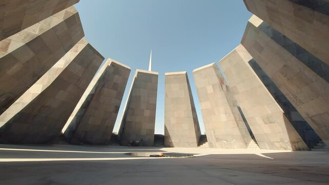 Yerevan, Armenia - 2024: Tsitsernakaberd memorial complex with eternal flame, dedicated to Armenian genocide victims, modern architecture under clear sky in Yerevan