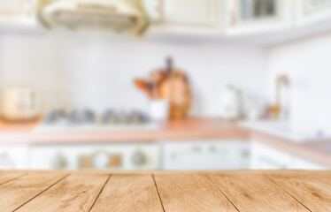 Wooden tabletop over defocused kitchen background. Minimal abstract background for product presentation. Element for design.